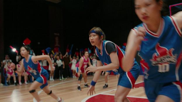 A group of women playing basketball  Description automatically generated