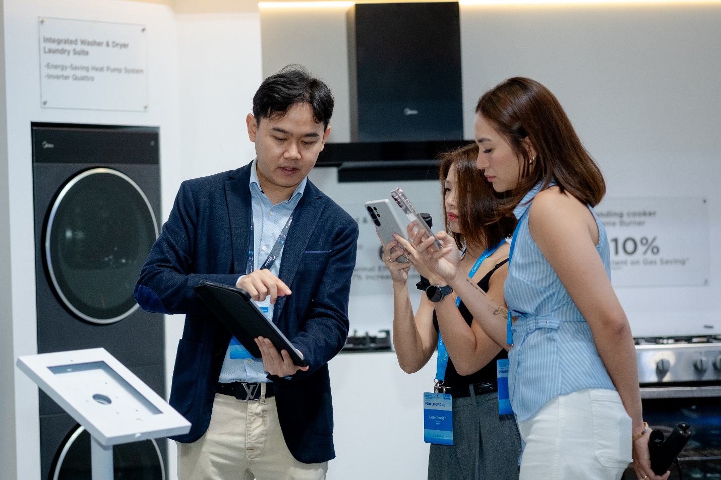 A group of people looking at a tablet  AI-generated content may be incorrect.