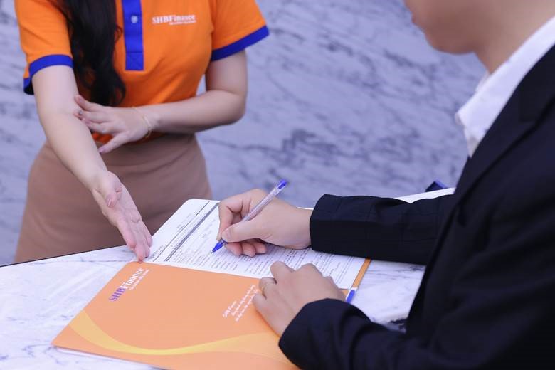 A person signing a document  AI-generated content may be incorrect., Picture