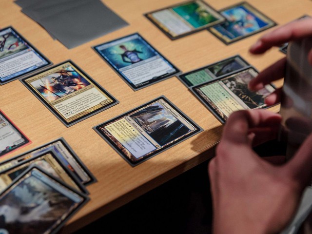 Prompt 3: A friendly customer handing over a binder of game cards to a smiling staff member at the counter of Ngọc Hiển Book. The background shows a mix of books and card game related decor, emphasizing the seamless integration of services. Bright, welcoming environment.
